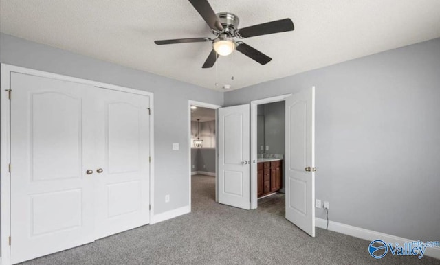 unfurnished bedroom featuring light carpet, a closet, and ceiling fan