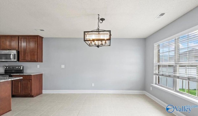 kitchen with a wealth of natural light, a chandelier, decorative light fixtures, and black range with electric cooktop