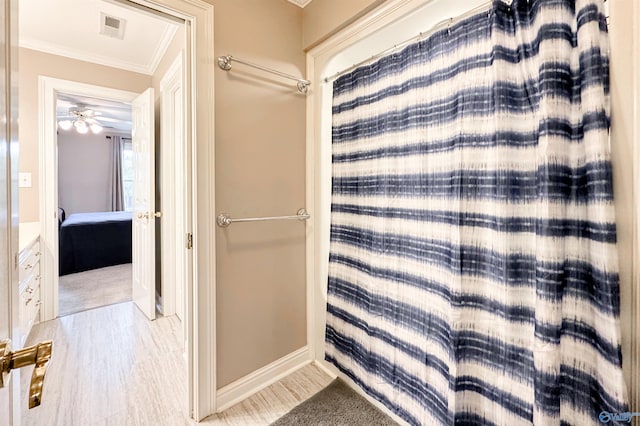 904 Whispering Pines Trl, Decatur, AL 35603 - full bath with ornamental molding, wood finished floors, and baseboards