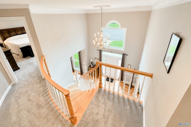 904 Whispering Pines Trl, Decatur, AL 35603 - stairs featuring healthy amount of natural light, a chandelier, crown molding, baseboards, and a towering ceiling
