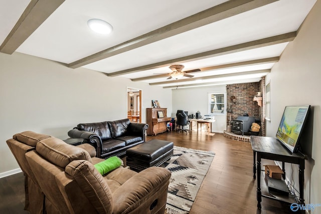 living area with baseboards, dark wood finished floors, and beam ceiling