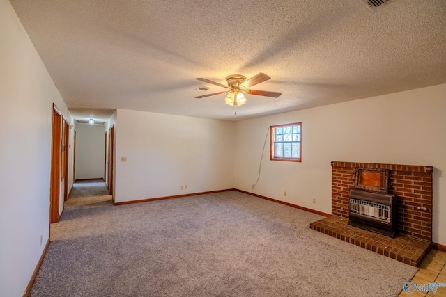 unfurnished living room featuring visible vents, baseboards, ceiling fan, a textured ceiling, and light carpet