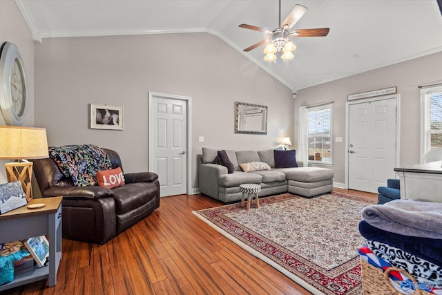 living room with crown molding, lofted ceiling, hardwood / wood-style floors, and ceiling fan