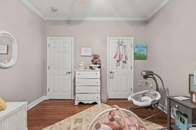 bedroom featuring ornamental molding and dark hardwood / wood-style floors