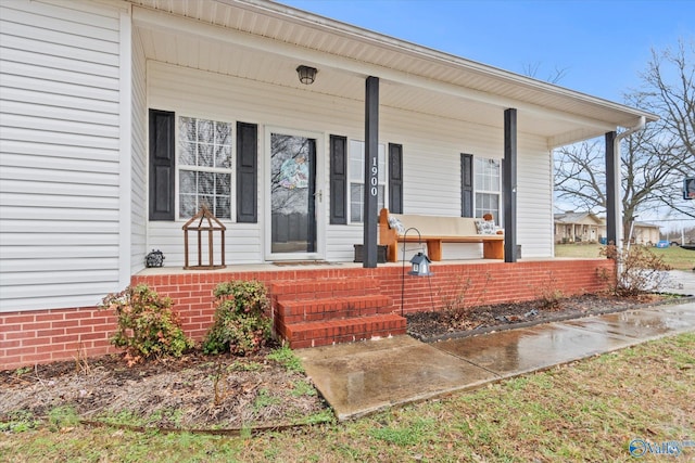 doorway to property featuring a porch