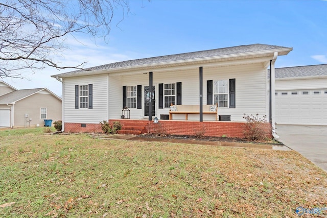 ranch-style house featuring a garage, a front yard, and covered porch