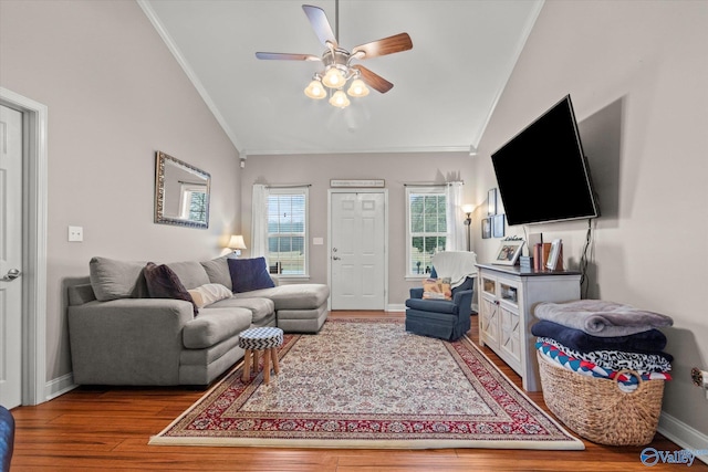 living room with hardwood / wood-style flooring, ornamental molding, lofted ceiling, and ceiling fan