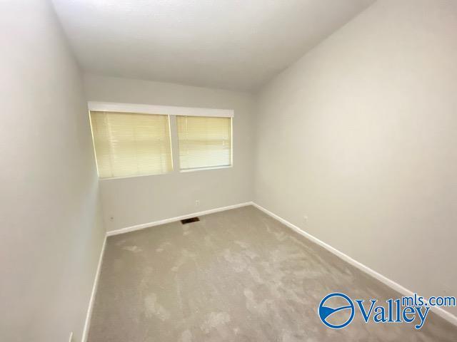 empty room with carpet flooring