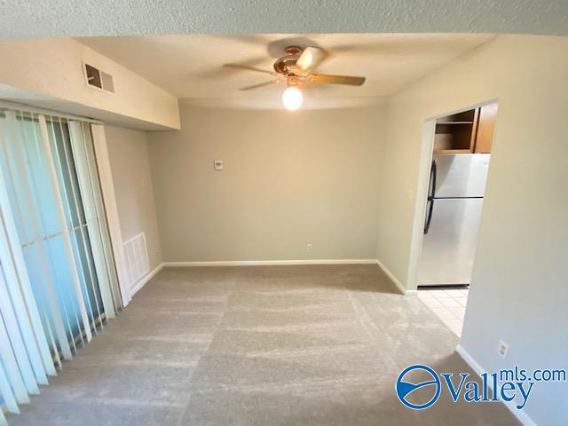 spare room with ceiling fan