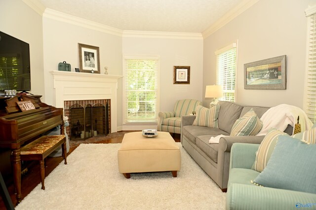 living room with crown molding and a brick fireplace