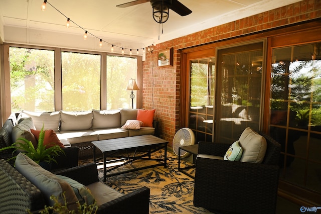 sunroom with ceiling fan and a wealth of natural light