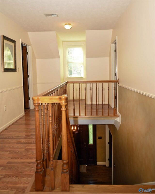 stairway with wood-type flooring