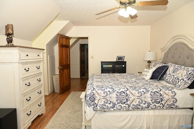 bedroom with dark wood-type flooring and ceiling fan