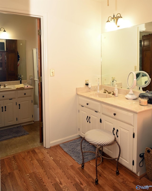 bathroom featuring wood-type flooring and vanity