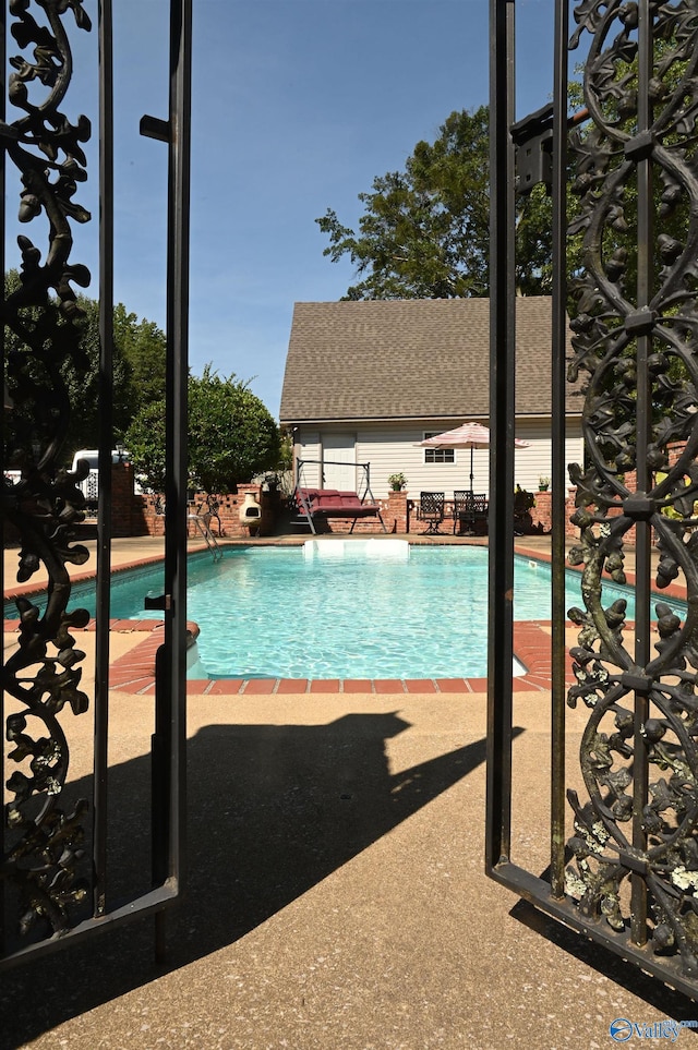 view of pool featuring a patio area