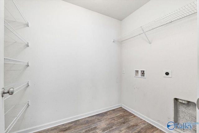 clothes washing area featuring hookup for an electric dryer, dark hardwood / wood-style floors, and hookup for a washing machine