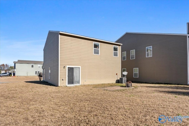 back of house featuring a yard