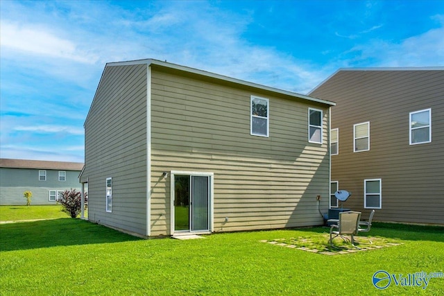 back of property with a yard