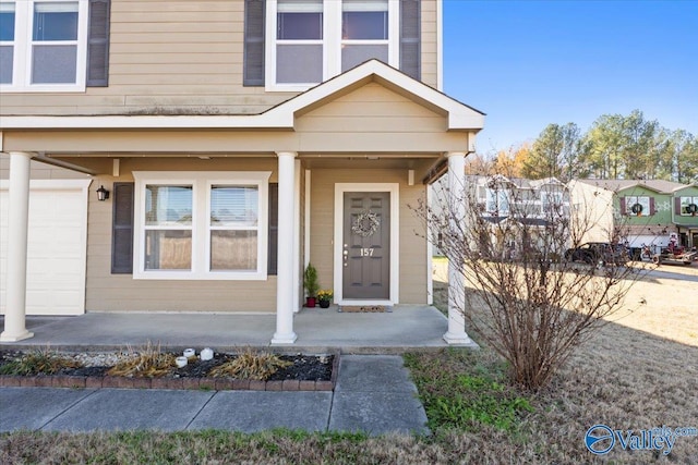 doorway to property with covered porch