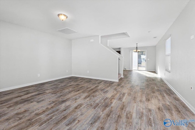 unfurnished living room with hardwood / wood-style floors