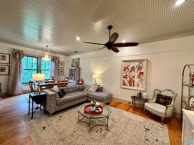 living room featuring ceiling fan and light hardwood / wood-style floors