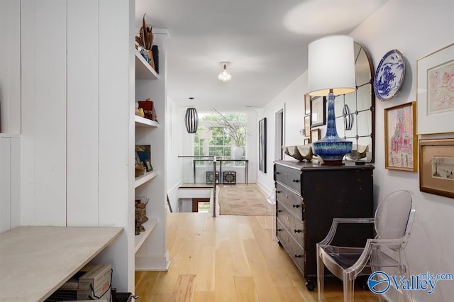 hall with light hardwood / wood-style floors