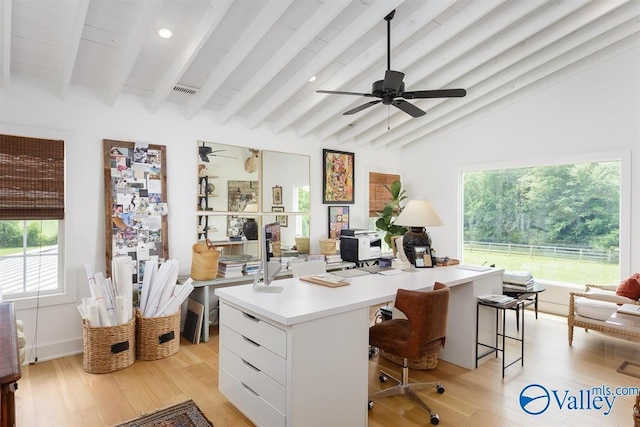 office with ceiling fan, light hardwood / wood-style flooring, and vaulted ceiling with beams