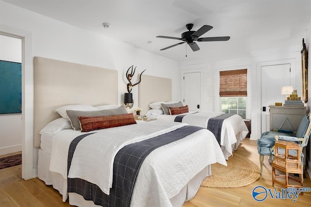 bedroom with hardwood / wood-style flooring and ceiling fan