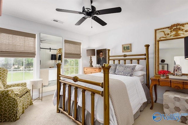 carpeted bedroom featuring ceiling fan