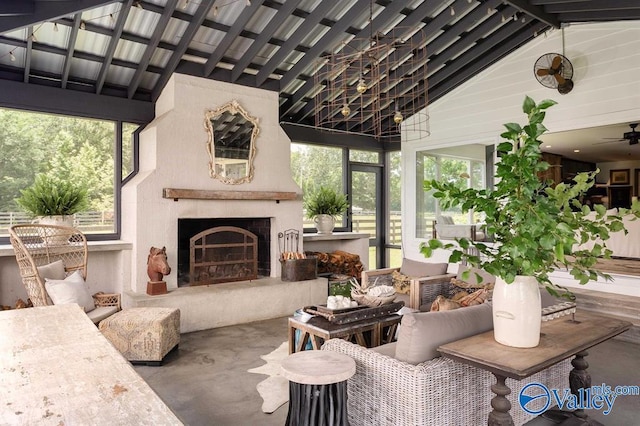 view of patio / terrace with an outdoor living space with a fireplace