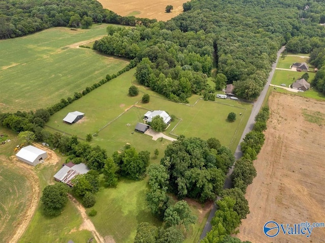 birds eye view of property with a rural view