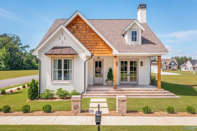 25 Sweet Laurel Pl, Gadsden, AL 35901 - modern inspired farmhouse with french doors, a chimney, a front yard, and a shingled roof