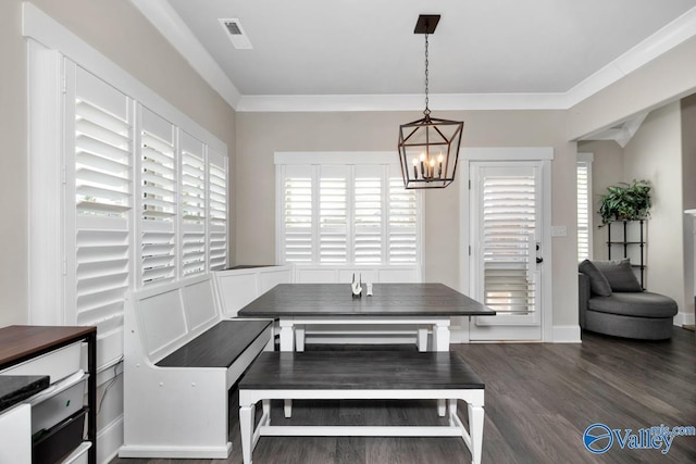 dining room with breakfast area, visible vents, plenty of natural light, and wood finished floors