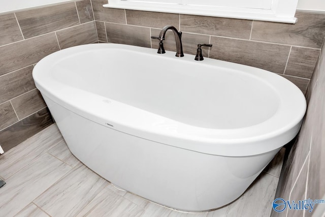 full bathroom with a freestanding tub