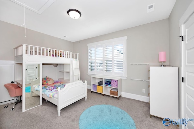 carpeted bedroom with attic access, visible vents, and baseboards