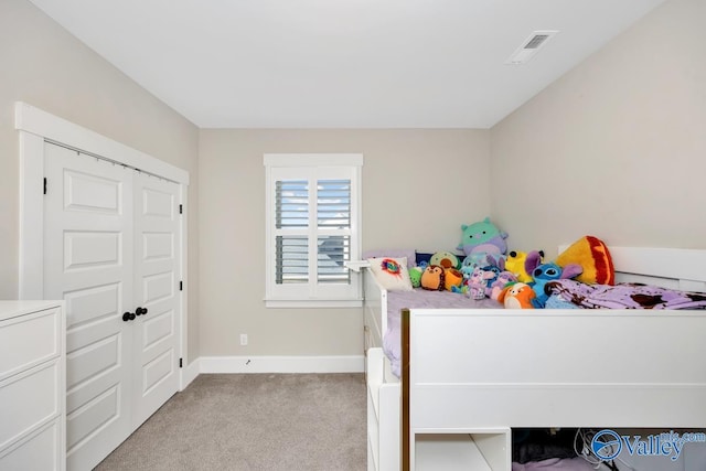 bedroom featuring light carpet, visible vents, and baseboards