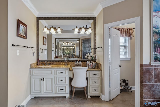 bathroom featuring baseboards, crown molding, and vanity