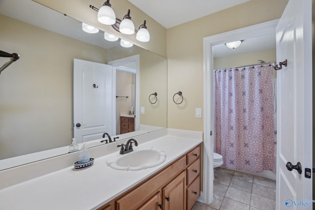 full bathroom with curtained shower, vanity, toilet, and tile patterned floors