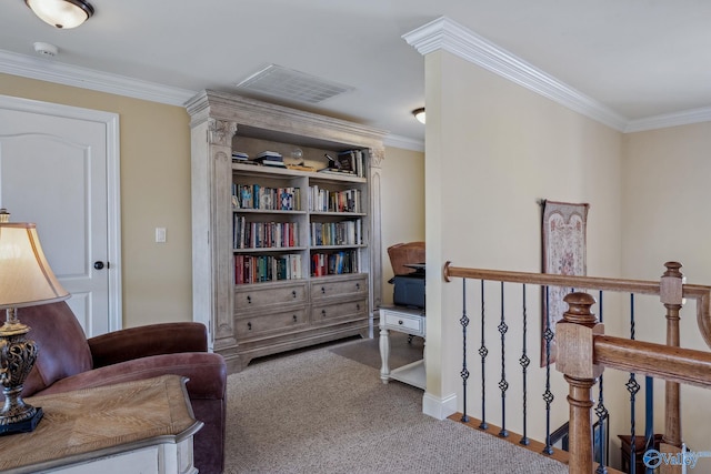 living area with carpet, visible vents, crown molding, and an upstairs landing