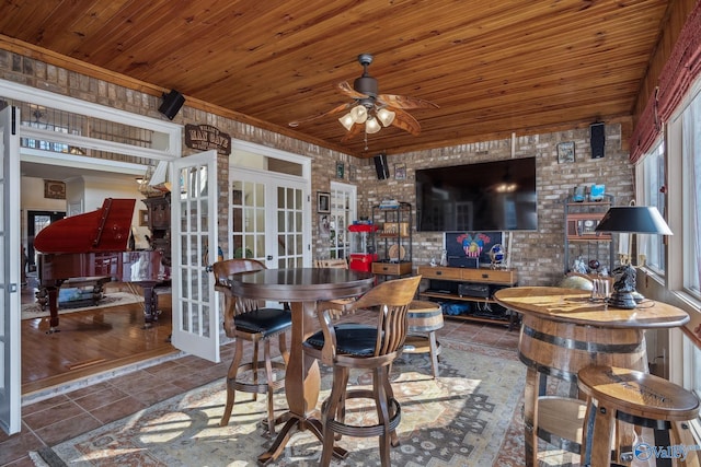 interior space with wood ceiling, ceiling fan, tile patterned flooring, and french doors