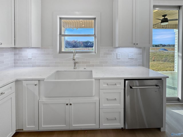 kitchen featuring white cabinetry, a sink, and stainless steel dishwasher