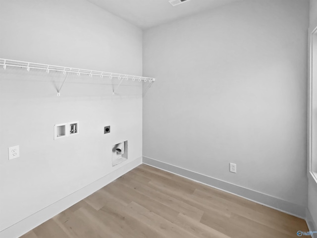 laundry room with washer hookup, light wood-style flooring, hookup for an electric dryer, laundry area, and baseboards