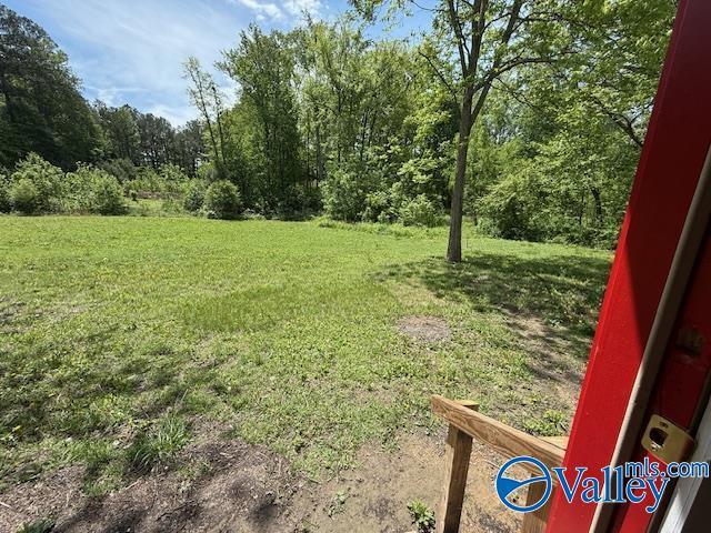 view of yard with a forest view