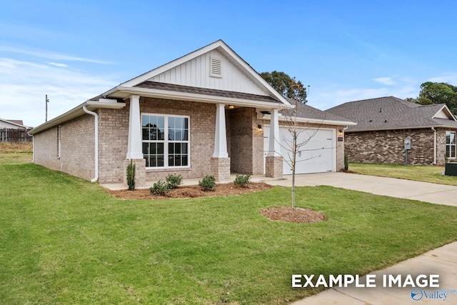 view of front facade with a garage and a front lawn