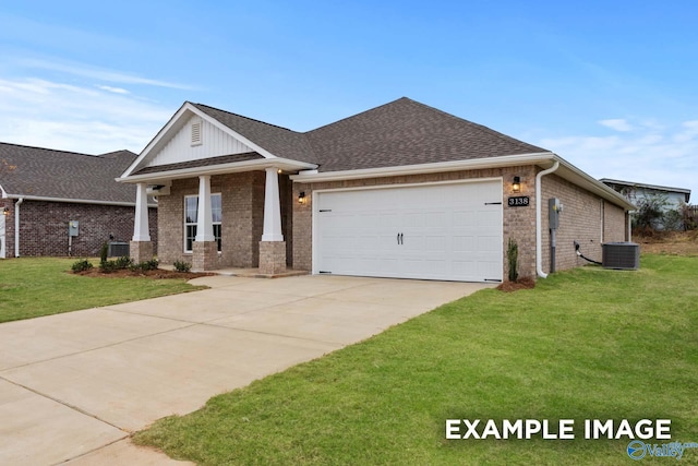 craftsman-style house with central air condition unit, a front lawn, and a garage