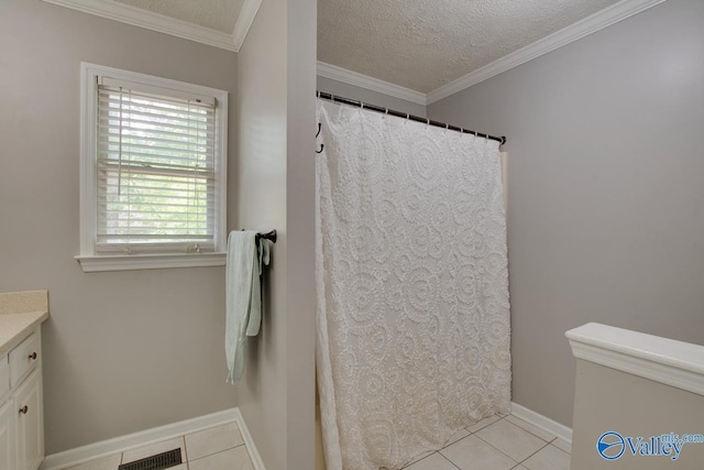 full bathroom featuring tile patterned flooring, visible vents, vanity, a shower with curtain, and a textured ceiling