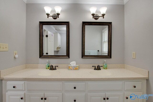 bathroom featuring a sink and double vanity