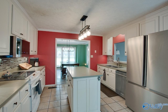 kitchen with backsplash, a sink, a center island, appliances with stainless steel finishes, and white cabinetry