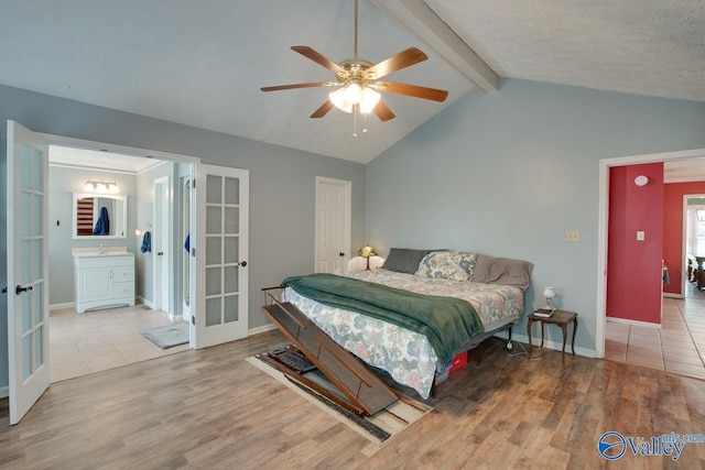 bedroom featuring a ceiling fan, wood finished floors, vaulted ceiling with beams, french doors, and baseboards
