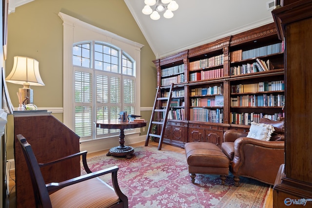 living area featuring a healthy amount of sunlight, high vaulted ceiling, visible vents, and wood finished floors